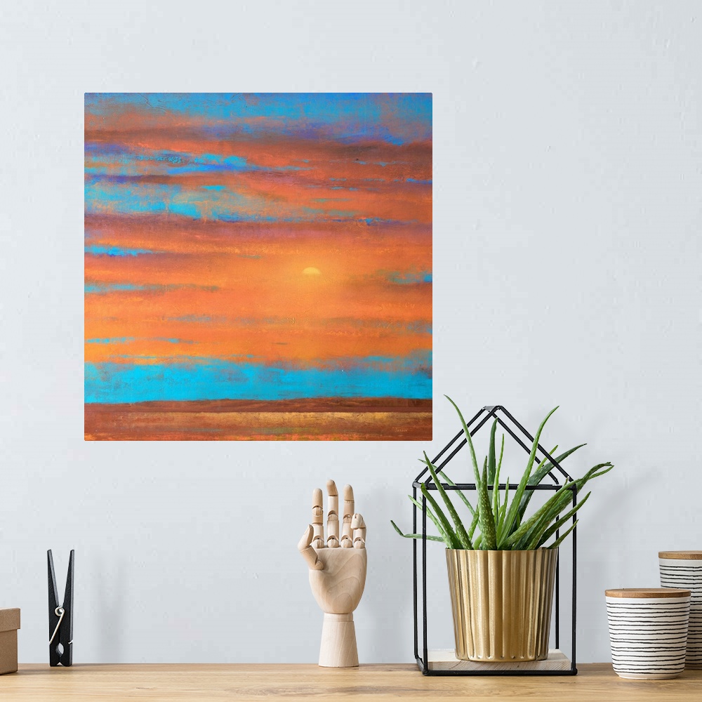 A bohemian room featuring A piece of contemporary artwork that is of a sunset with orange clouds painted on top of a bright...