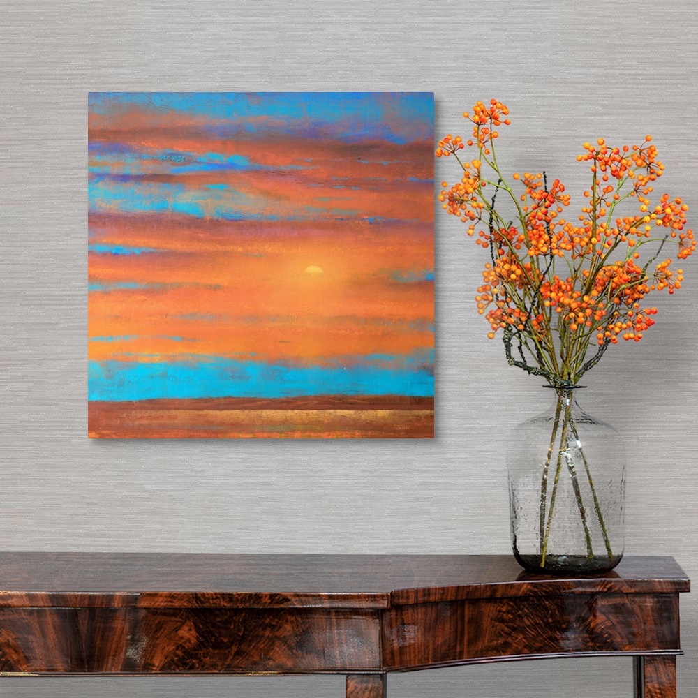 A traditional room featuring A piece of contemporary artwork that is of a sunset with orange clouds painted on top of a bright...