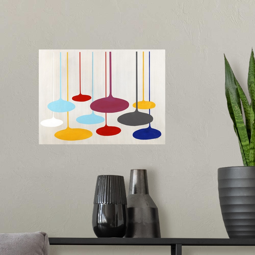 A modern room featuring Contemporary artwork with retro shapes in bright primary colors.