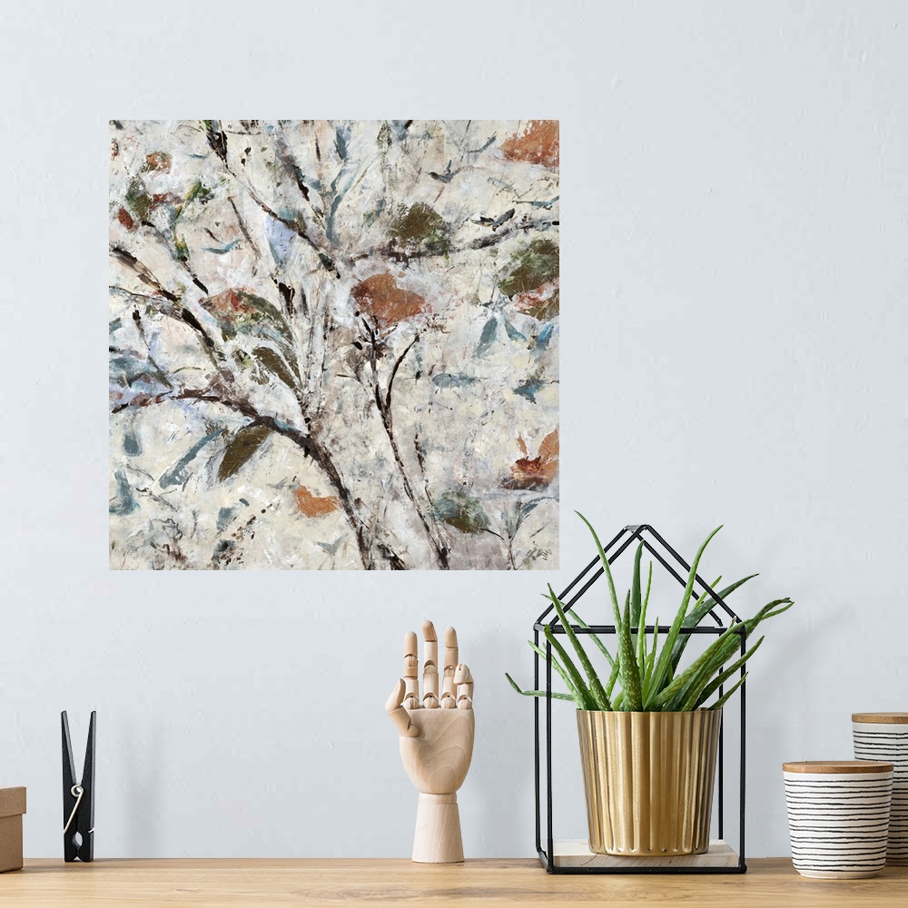 A bohemian room featuring Square abstract painting of a tree with thin, brown branches and green, orange, and blue fall lea...