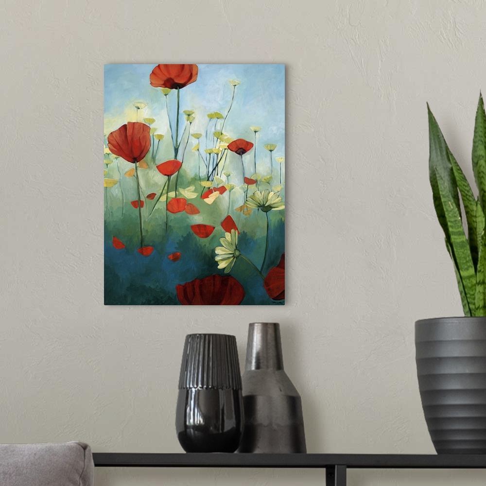 A modern room featuring Contemporary painting of red poppies in a green field with daisies, under a blue sky.