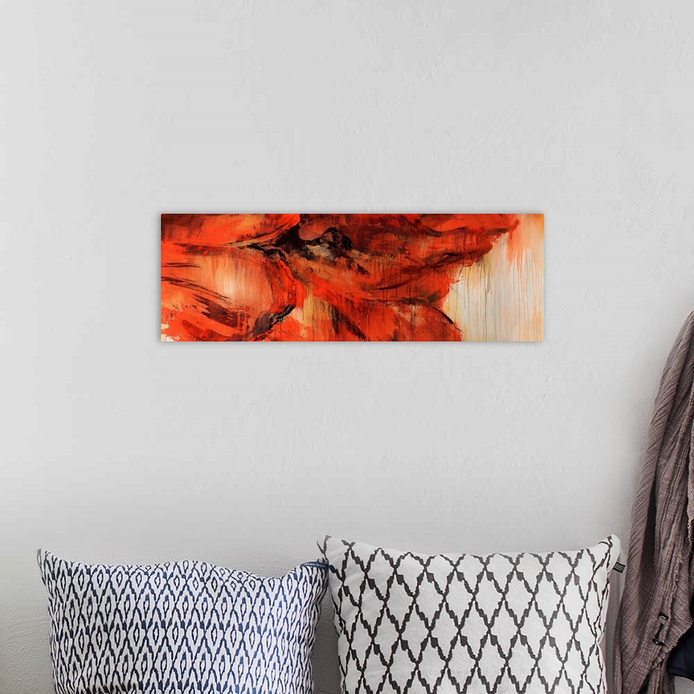 A bohemian room featuring An abstract piece of a very large red flower that has the paint dripping throughout the piece.