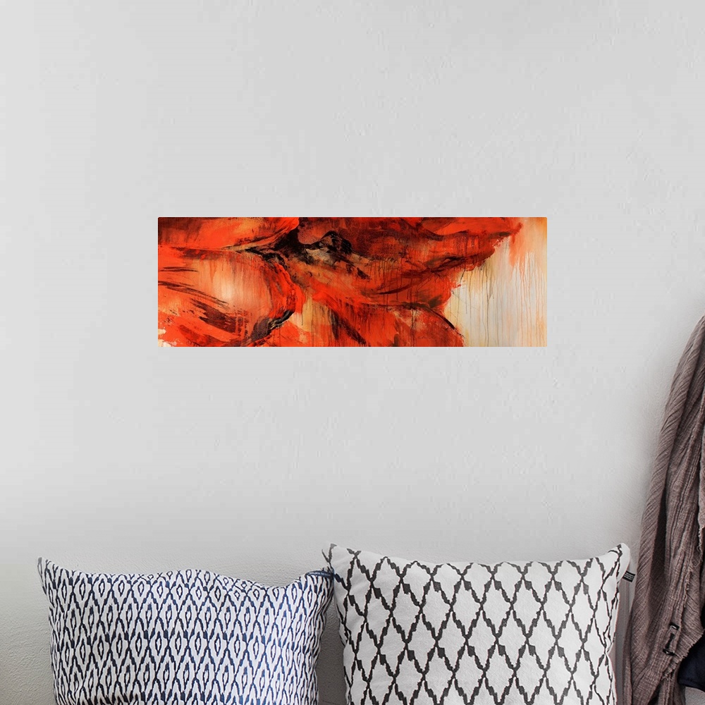A bohemian room featuring An abstract piece of a very large red flower that has the paint dripping throughout the piece.