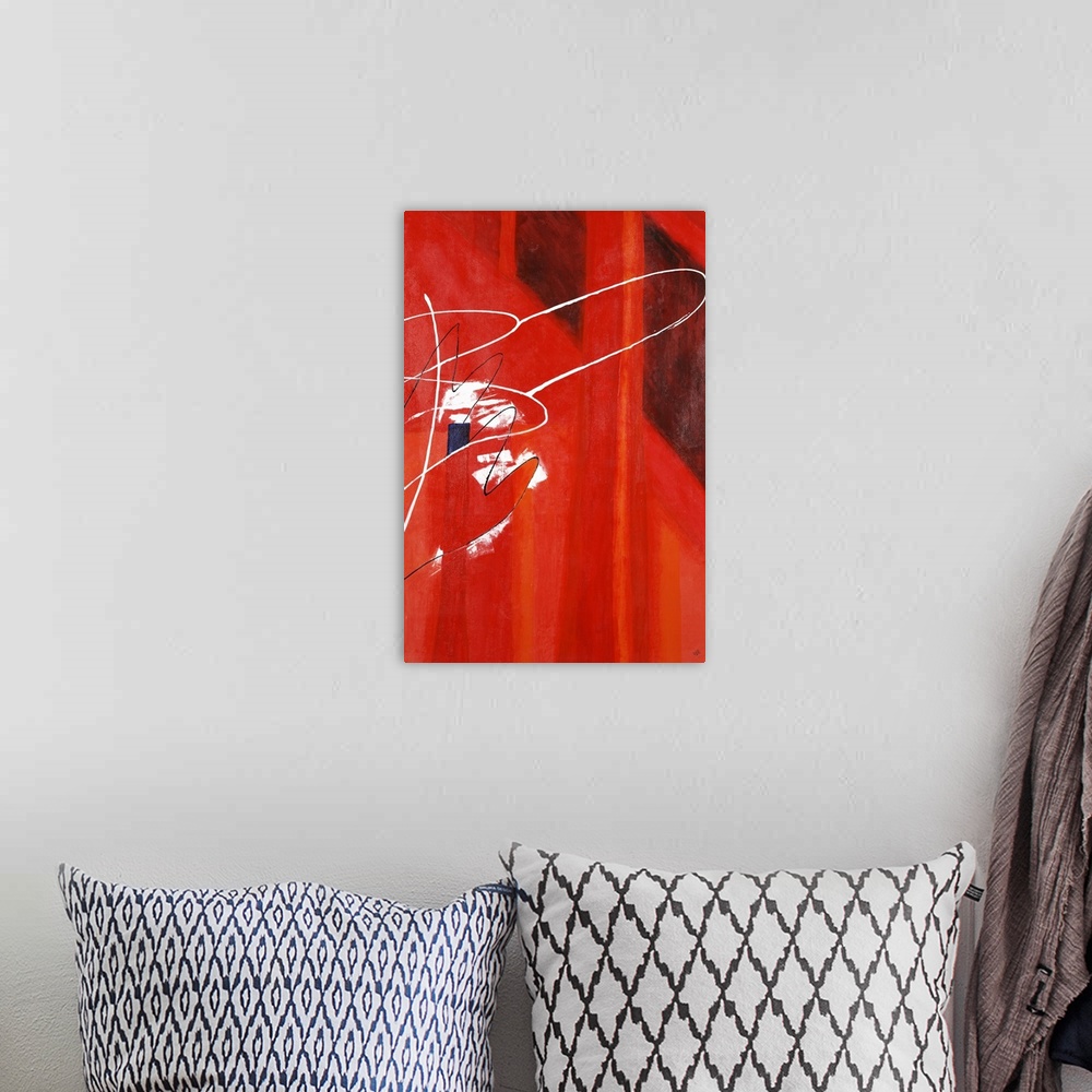 A bohemian room featuring A vibrant red abstract painting with white curved lines overlaying on one side.