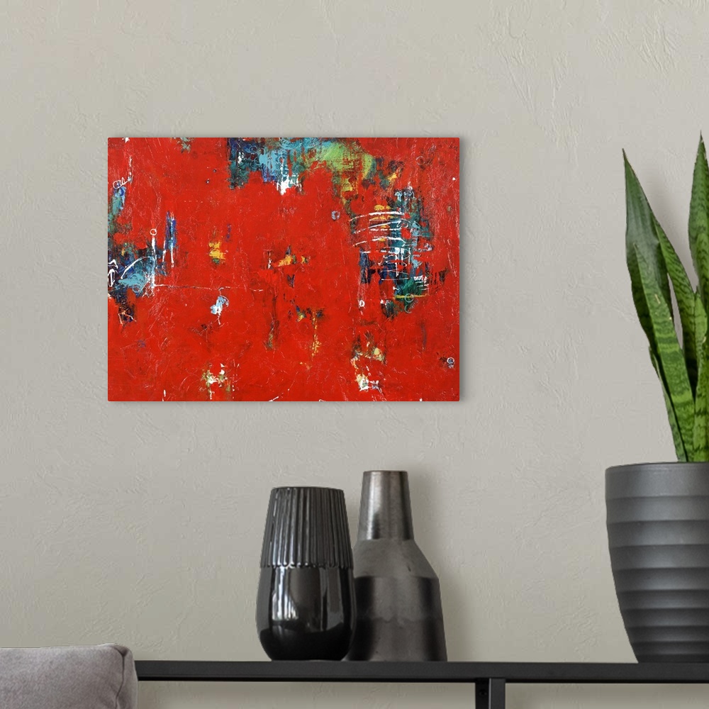 A modern room featuring Contemporary abstract artwork in sharp red with splashes of cool blue and green.