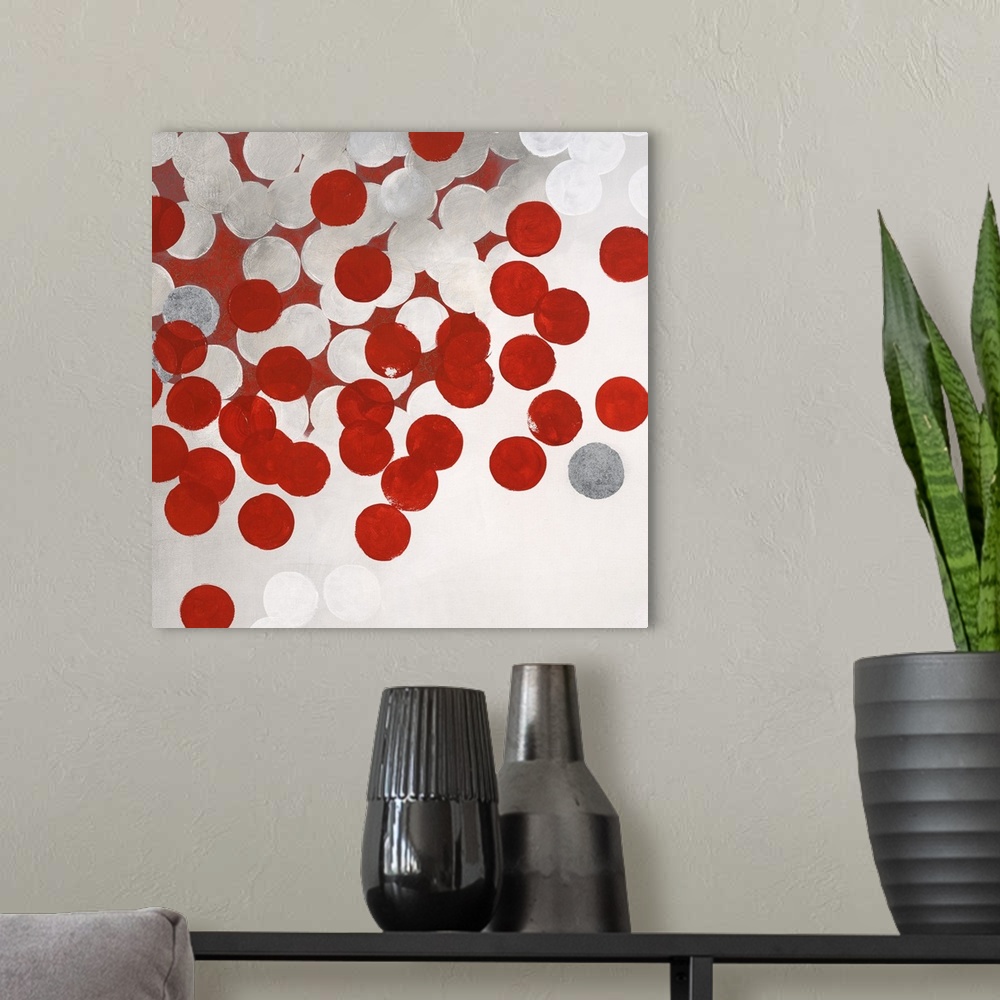 A modern room featuring Contemporary abstract artwork made of white and red dots.