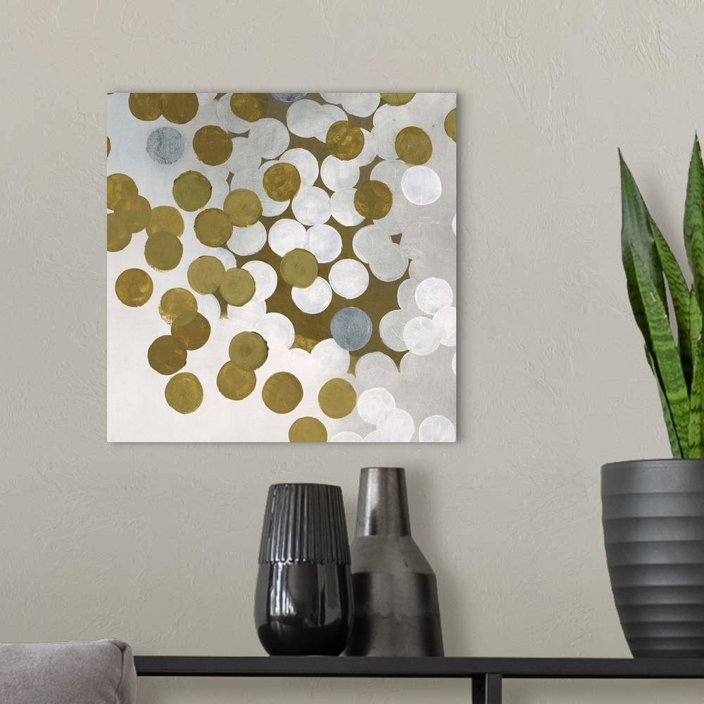 A modern room featuring Contemporary abstract artwork made of white and gold dots.