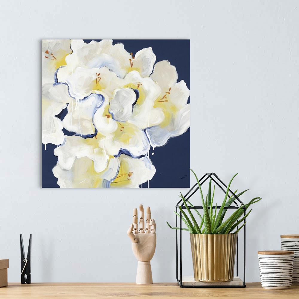 A bohemian room featuring Square painting of a bouquet of white Rhododendrons against a dark blue backdrop.