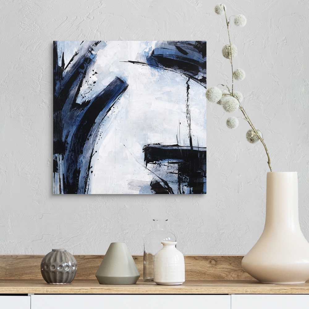 A farmhouse room featuring Abstract painting using dark blue and black colors against a pale blue blue background.