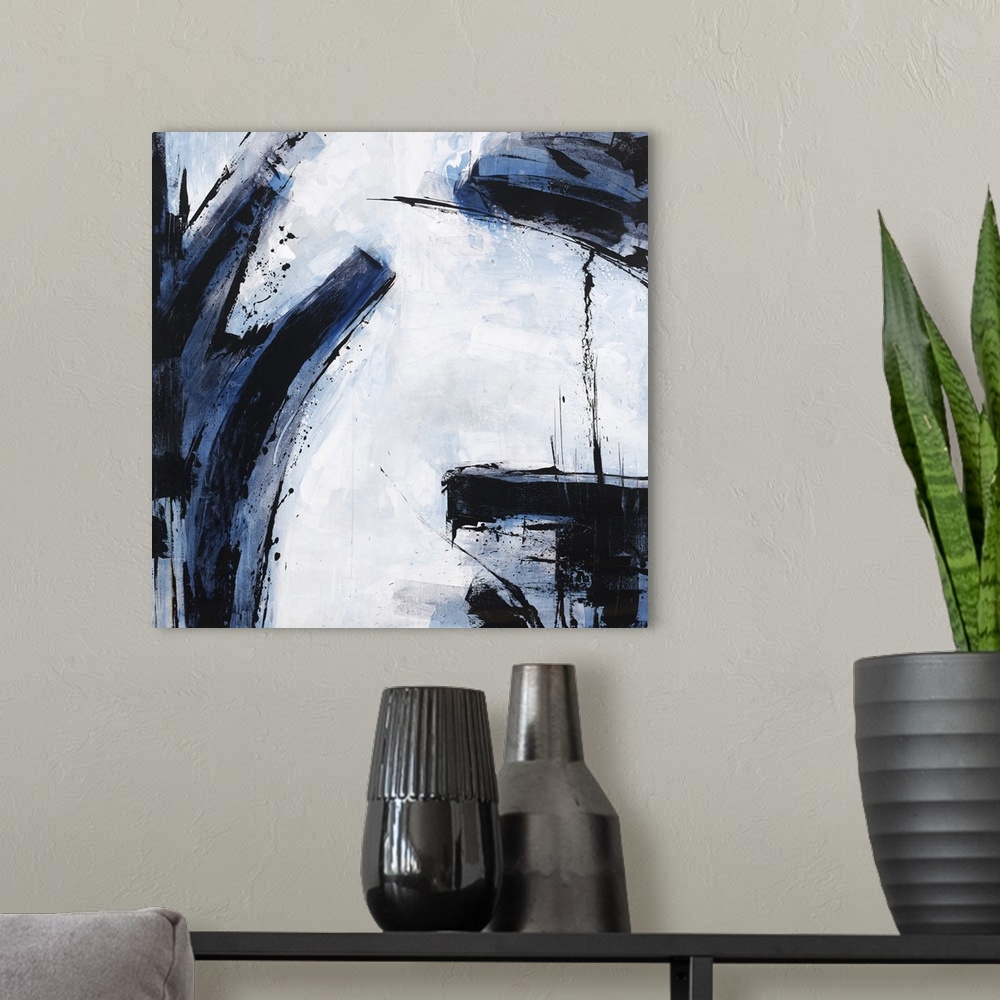 A modern room featuring Abstract painting using dark blue and black colors against a pale blue blue background.