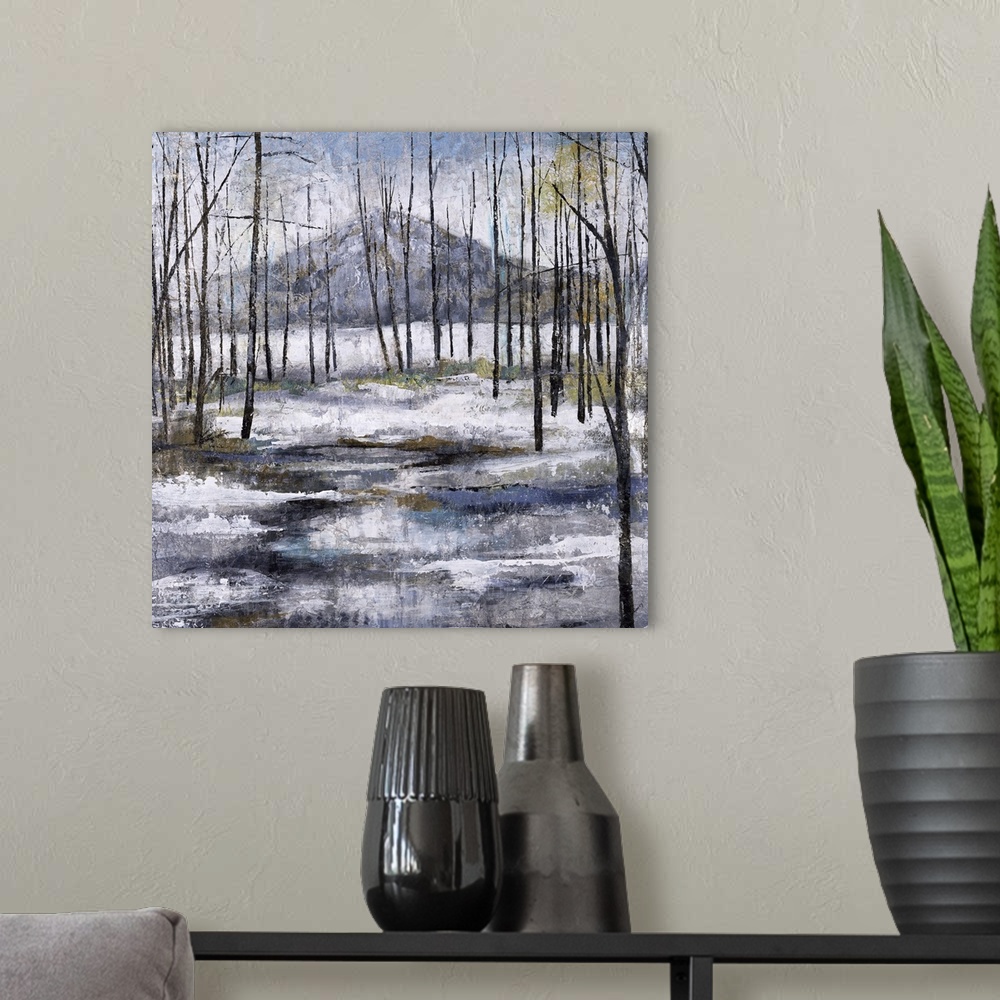 A modern room featuring Contemporary painting of a Winter landscape with bare trees, snow on the ground, and a mountain i...