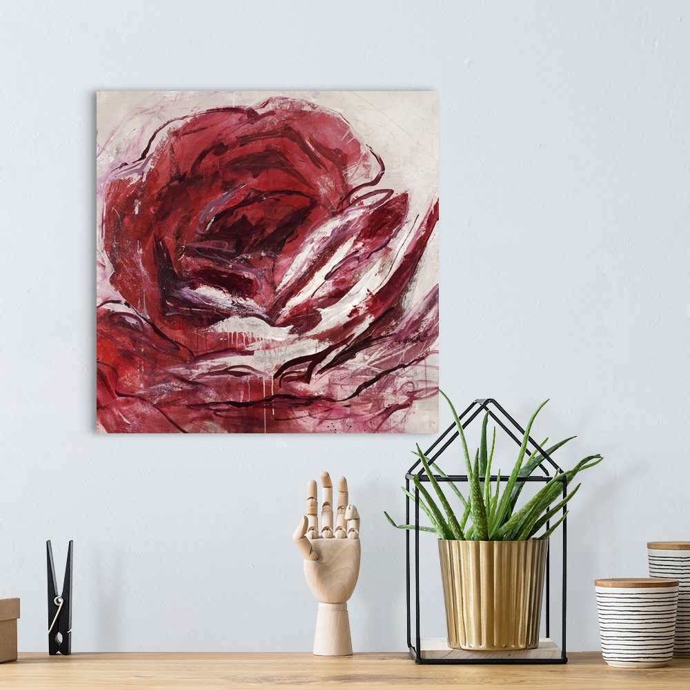 A bohemian room featuring Abstract painting of a red rose.