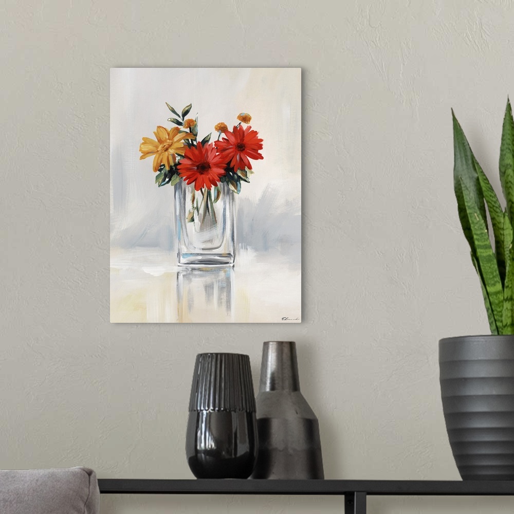 A modern room featuring Contemporary artwork of red and yellow daisies in a clear glass vase.