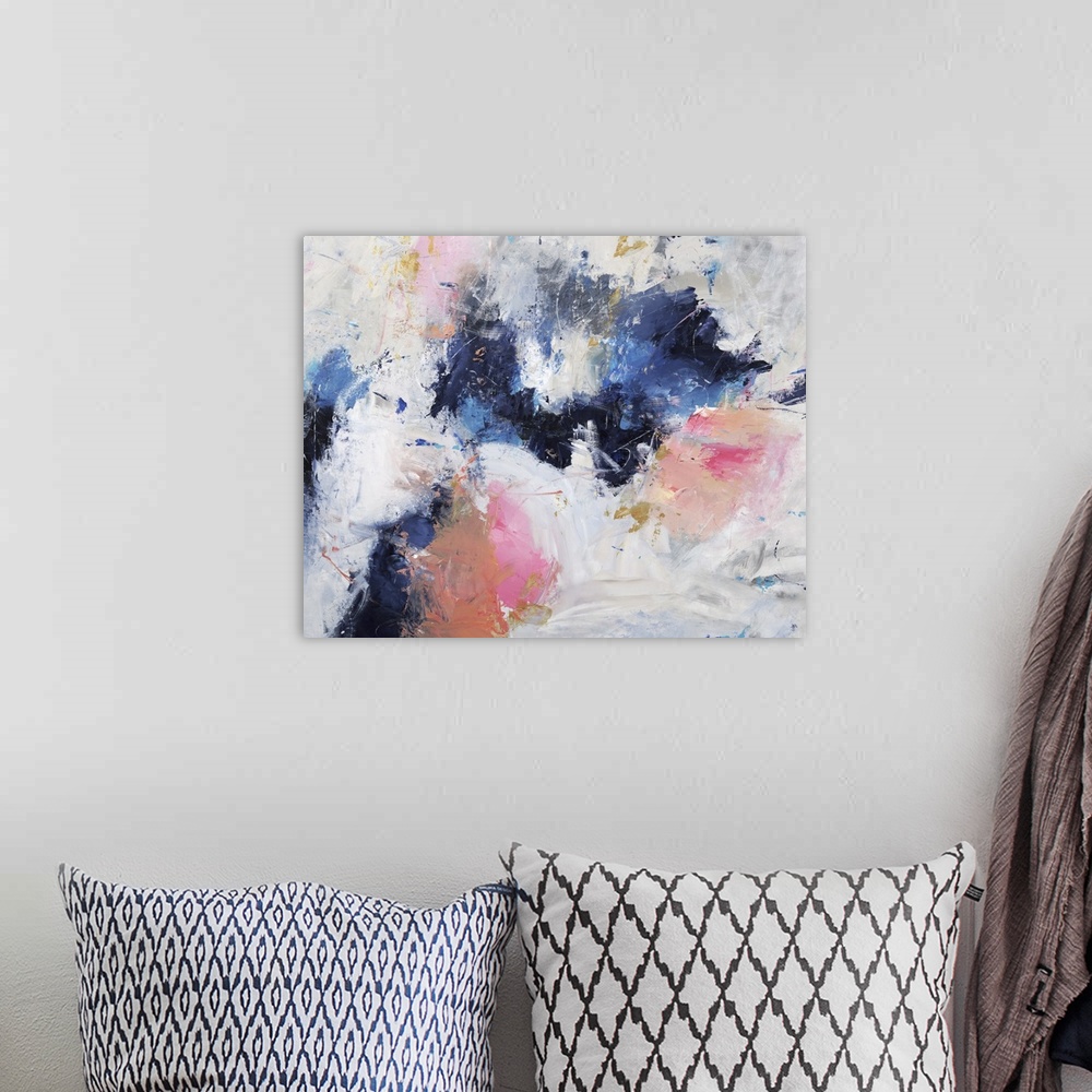 A bohemian room featuring Abstract painting with coll bursts of blue surrounded by warm bursts of pink on a gray toned back...