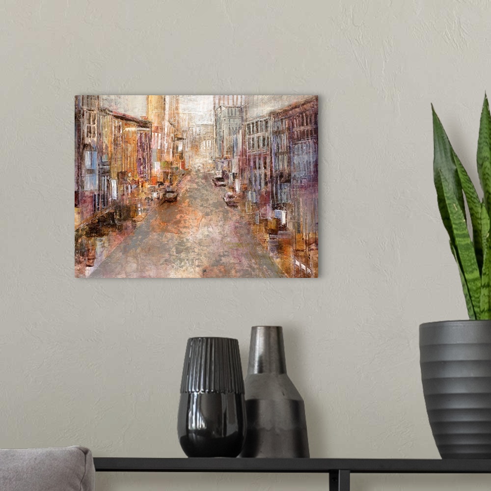 A modern room featuring A contemporary piece of artwork with multicolored buildings lining a street that goes back toward...