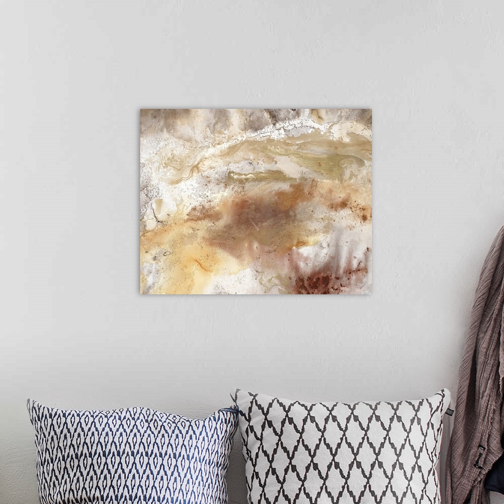 A bohemian room featuring An abstract painting of natural earth colors of brown and gold.