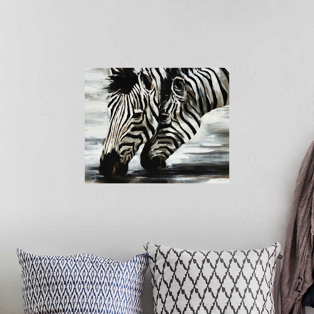 A bohemian room featuring Giant, horizontal painting of two zebras heads as they are bent down to drink water, closely toge...