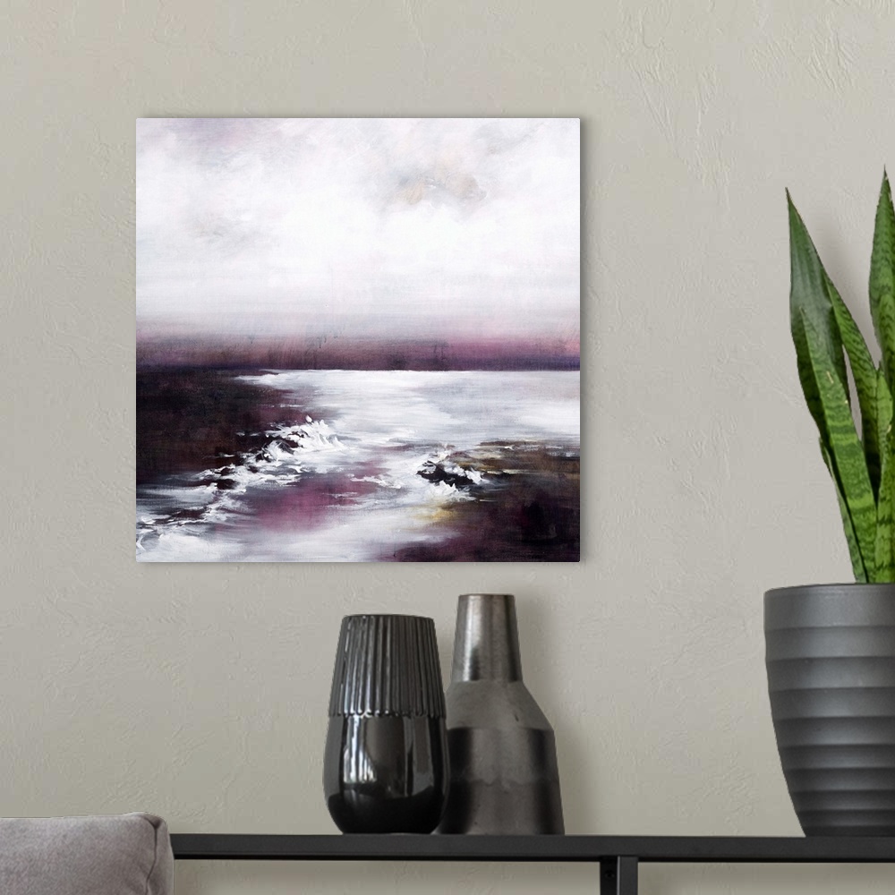 A modern room featuring Contemporary painting of a calm seascape with pink tones.