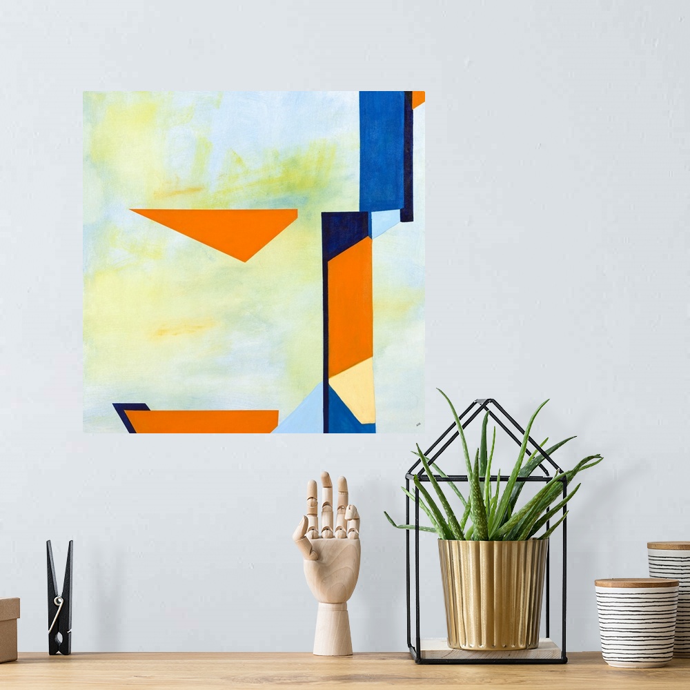 A bohemian room featuring Square abstract artwork with a light blue and green background and vibrant blue and orange shapes...