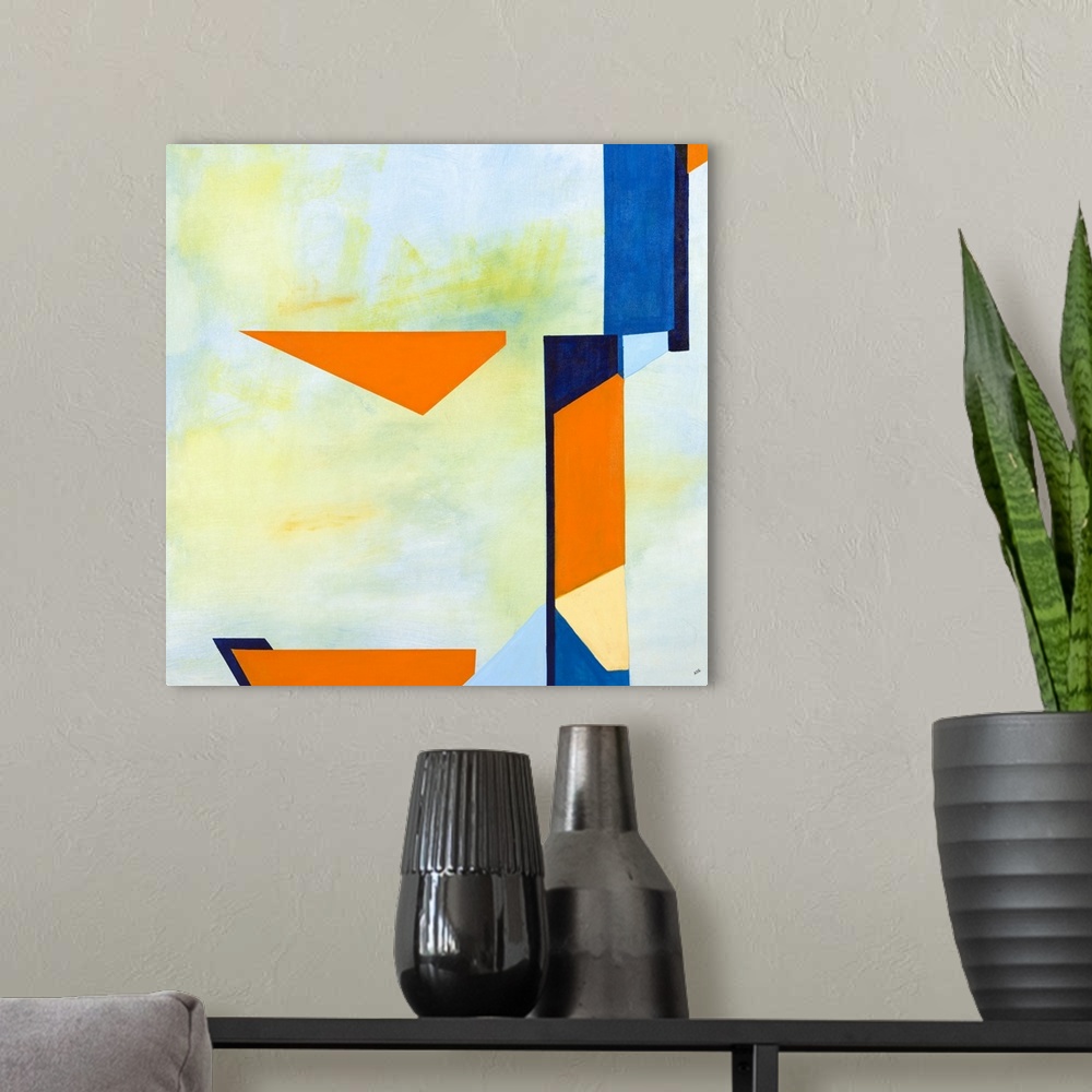 A modern room featuring Square abstract artwork with a light blue and green background and vibrant blue and orange shapes...