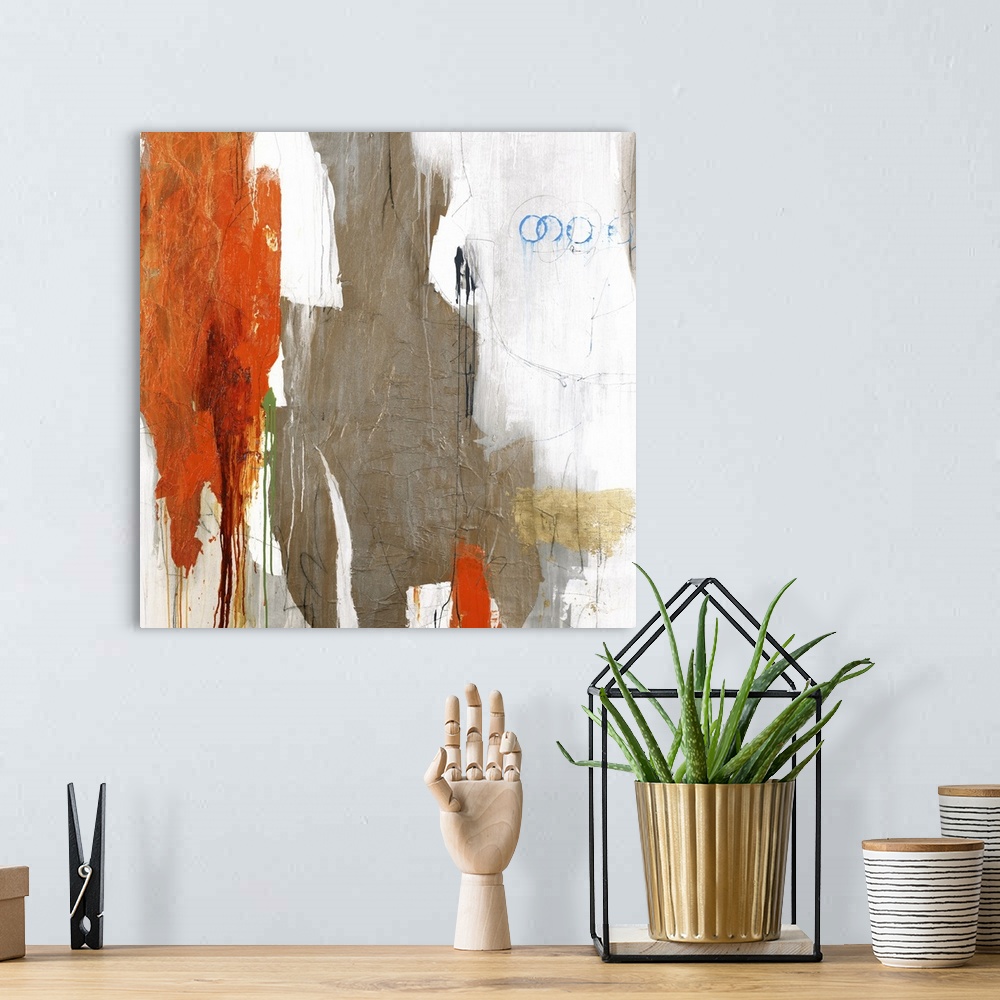 A bohemian room featuring Large abstract art with brown, orange, gray, white, blue, and green on a white background.