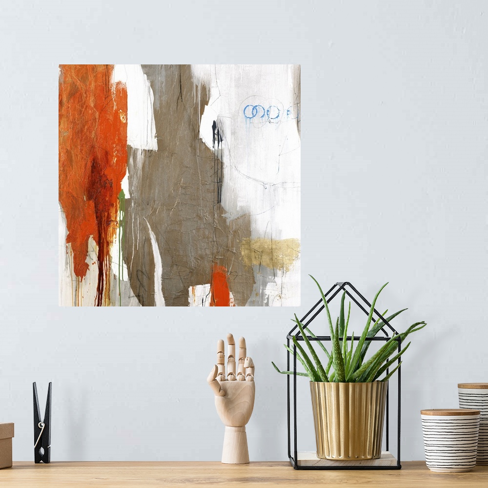 A bohemian room featuring Large abstract art with brown, orange, gray, white, blue, and green on a white background.