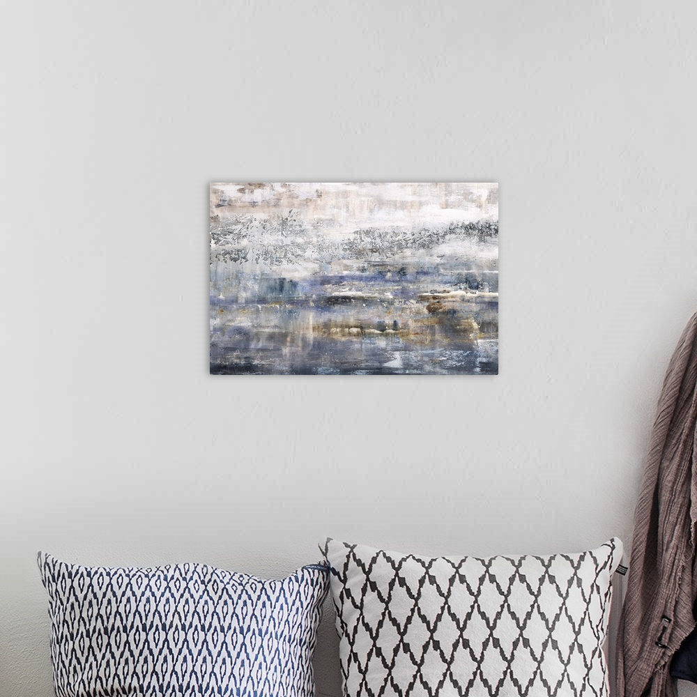 A bohemian room featuring Large abstract painting made with blue, orange, brown, and gray hues.