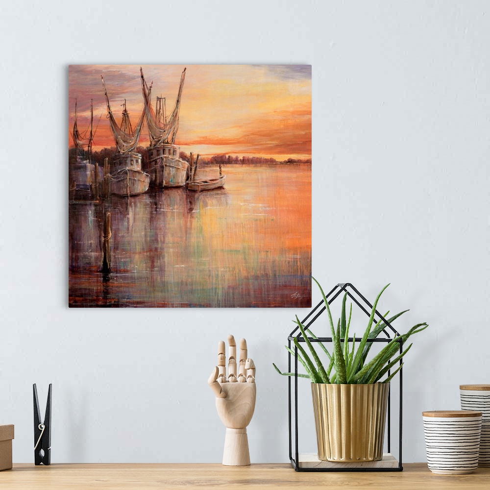 A bohemian room featuring Painting of old sailboats docked at sunset under a colorful cloudy sky.