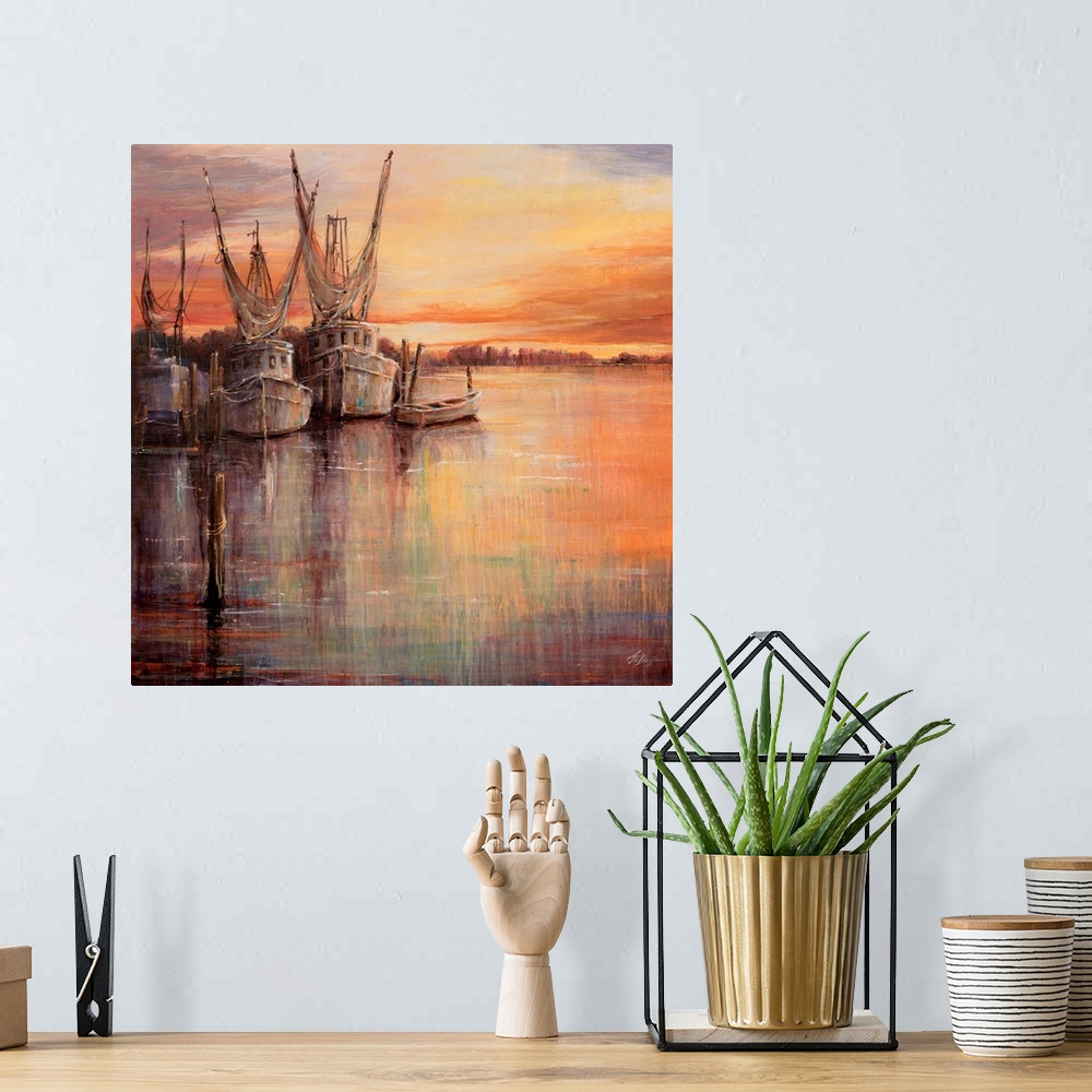 A bohemian room featuring Painting of old sailboats docked at sunset under a colorful cloudy sky.