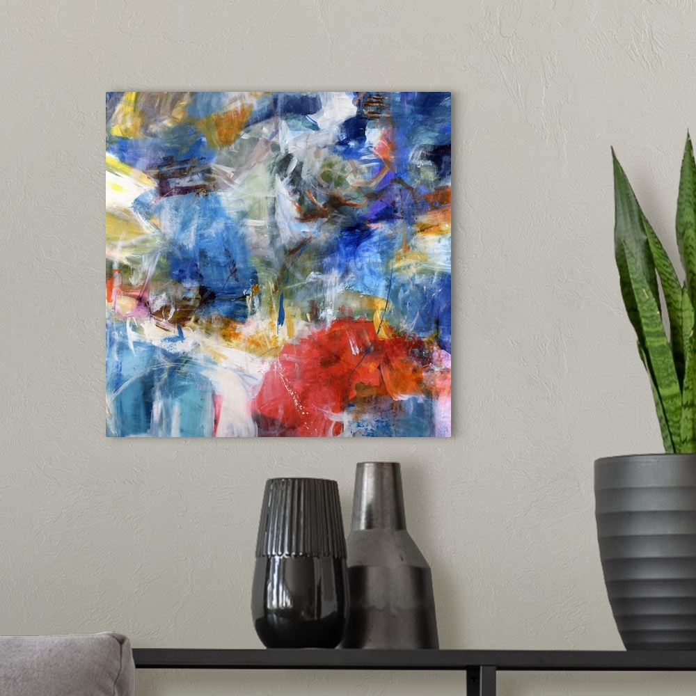 A modern room featuring Abstract painting of lots of colors and brushstrokes put together to create a Contemporary abstra...