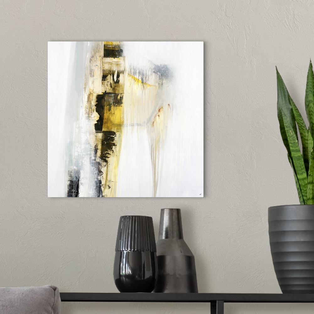 A modern room featuring Square abstract painting with a yellow and black vertical line going down the canvas with a faint...