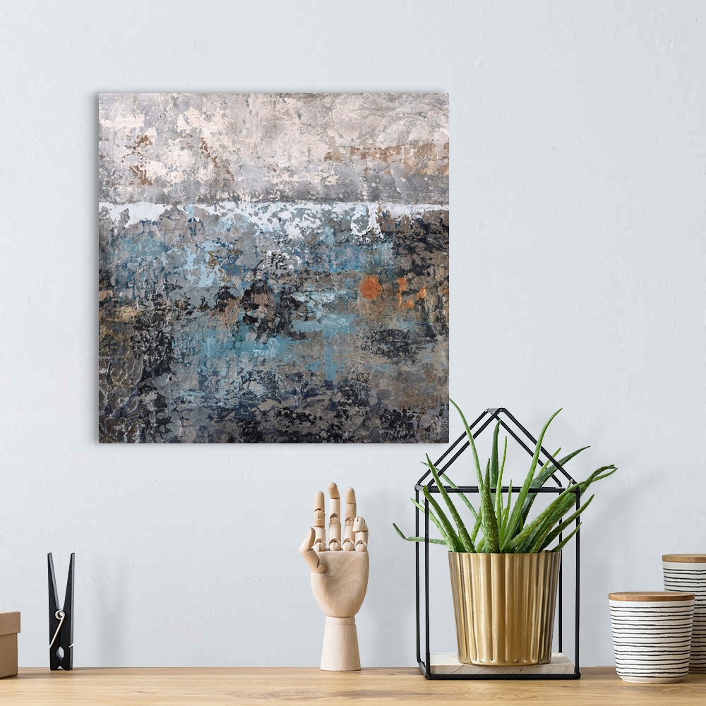 A bohemian room featuring Abstract painting using textured looking blue and gray tones to form what almost appears as a lan...