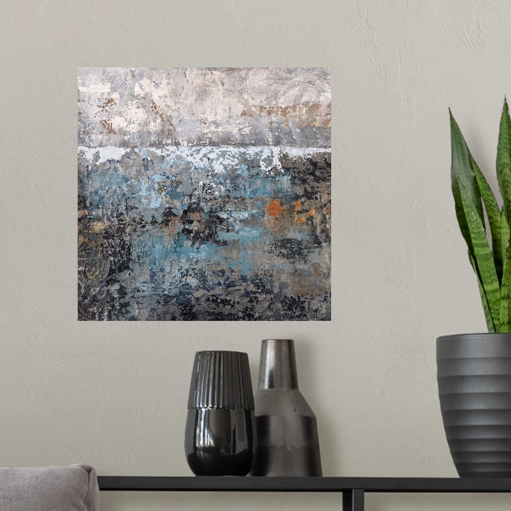 A modern room featuring Abstract painting using textured looking blue and gray tones to form what almost appears as a lan...
