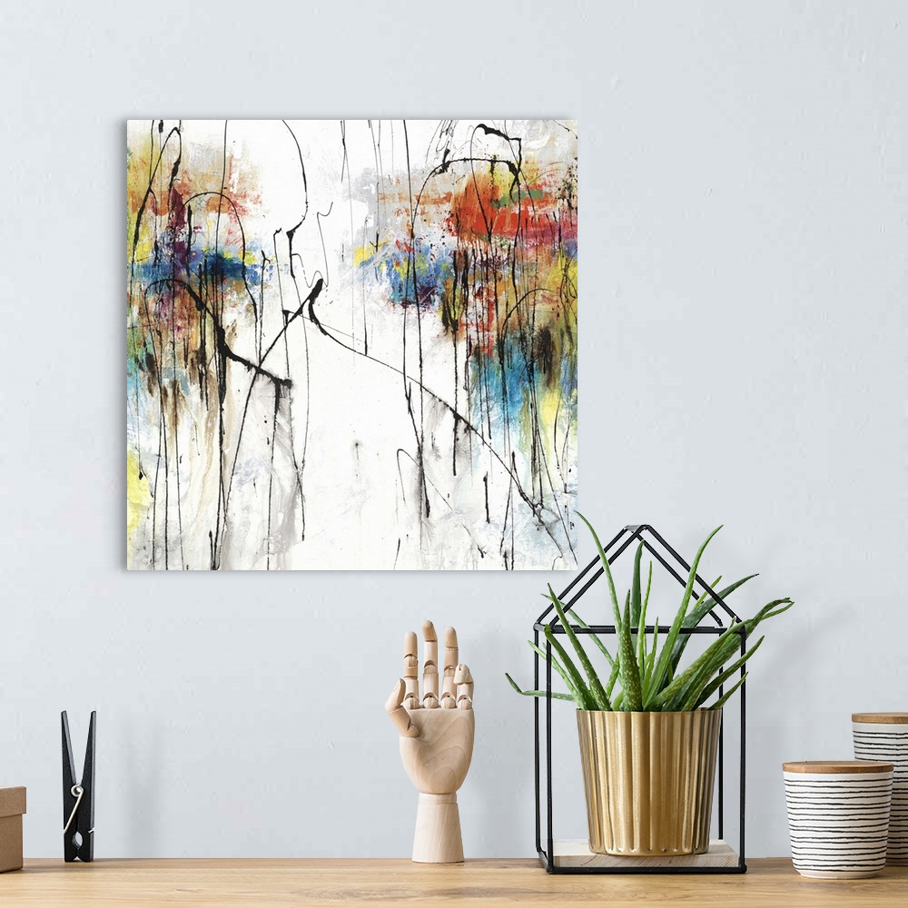 A bohemian room featuring Square abstract art with clusters of color on the two sides on a white and gray background with t...