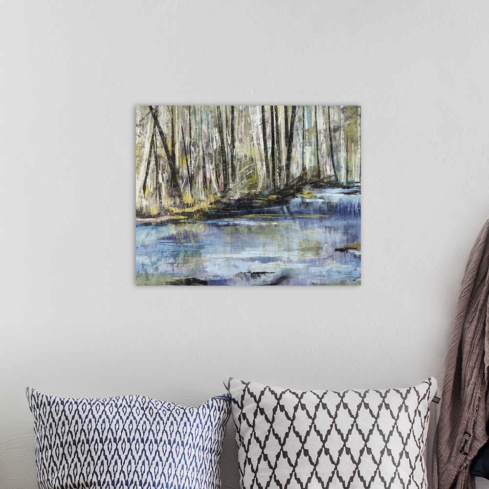 A bohemian room featuring Horizontal painting of a river flowing through a forest.