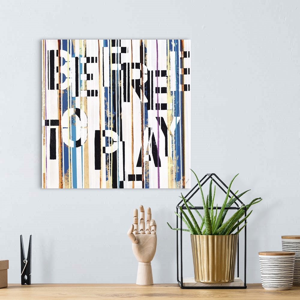 A bohemian room featuring Contemporary artwork with the text "be free to play" hidden in vertical stripes.