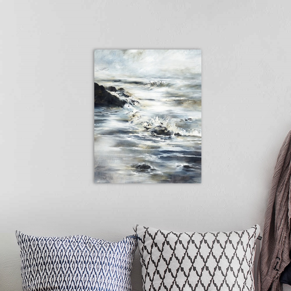A bohemian room featuring Contemporary painting of a beach landscape with waves crashing onto the shore and large rocks.