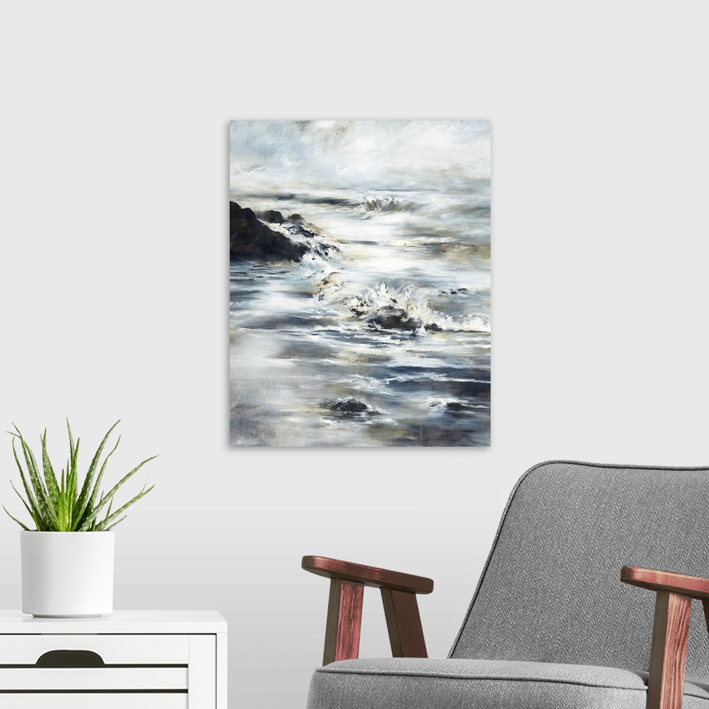 A modern room featuring Contemporary painting of a beach landscape with waves crashing onto the shore and large rocks.