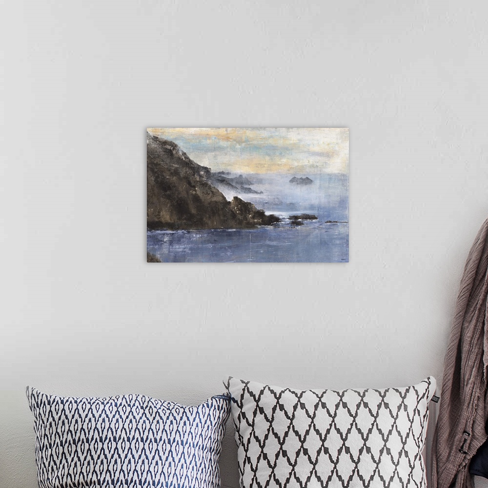A bohemian room featuring Contemporary landscape painting of blue water surrounded by rocky cliffs.