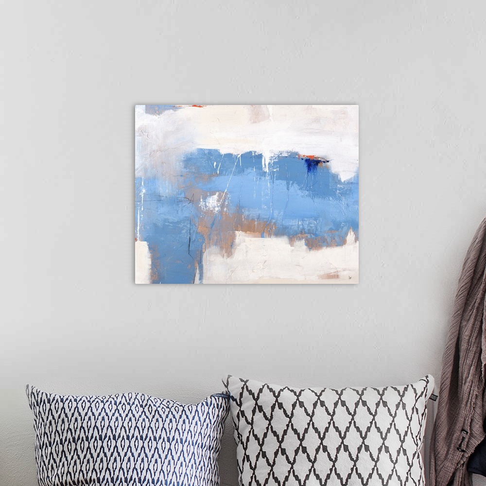 A bohemian room featuring Large abstract painting with layered shades of blue and brown on a white and cream background wit...