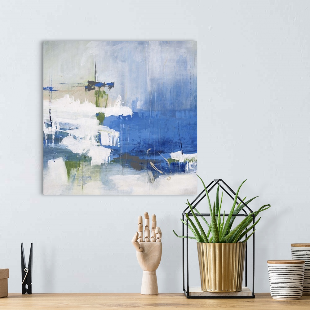 A bohemian room featuring Contemporary abstract painting of bright blues and greens against a faded washed out background.