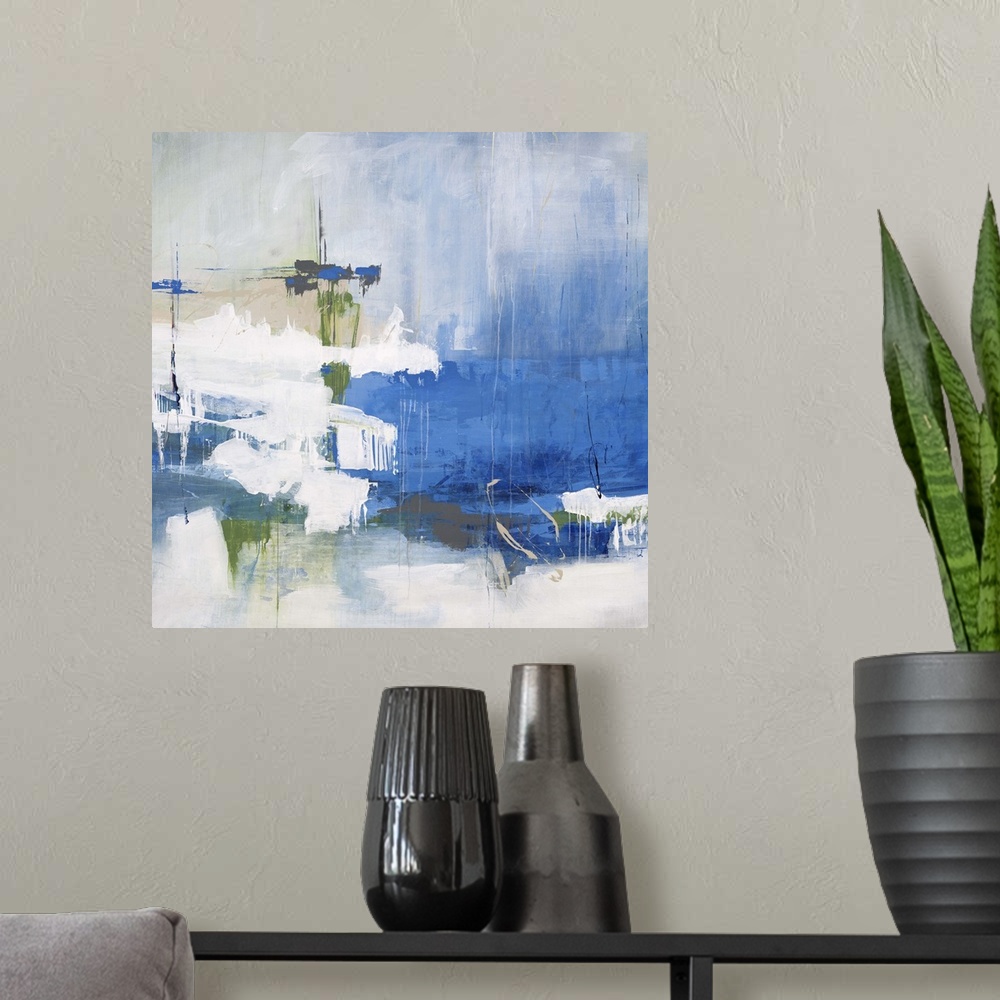 A modern room featuring Contemporary abstract painting of bright blues and greens against a faded washed out background.