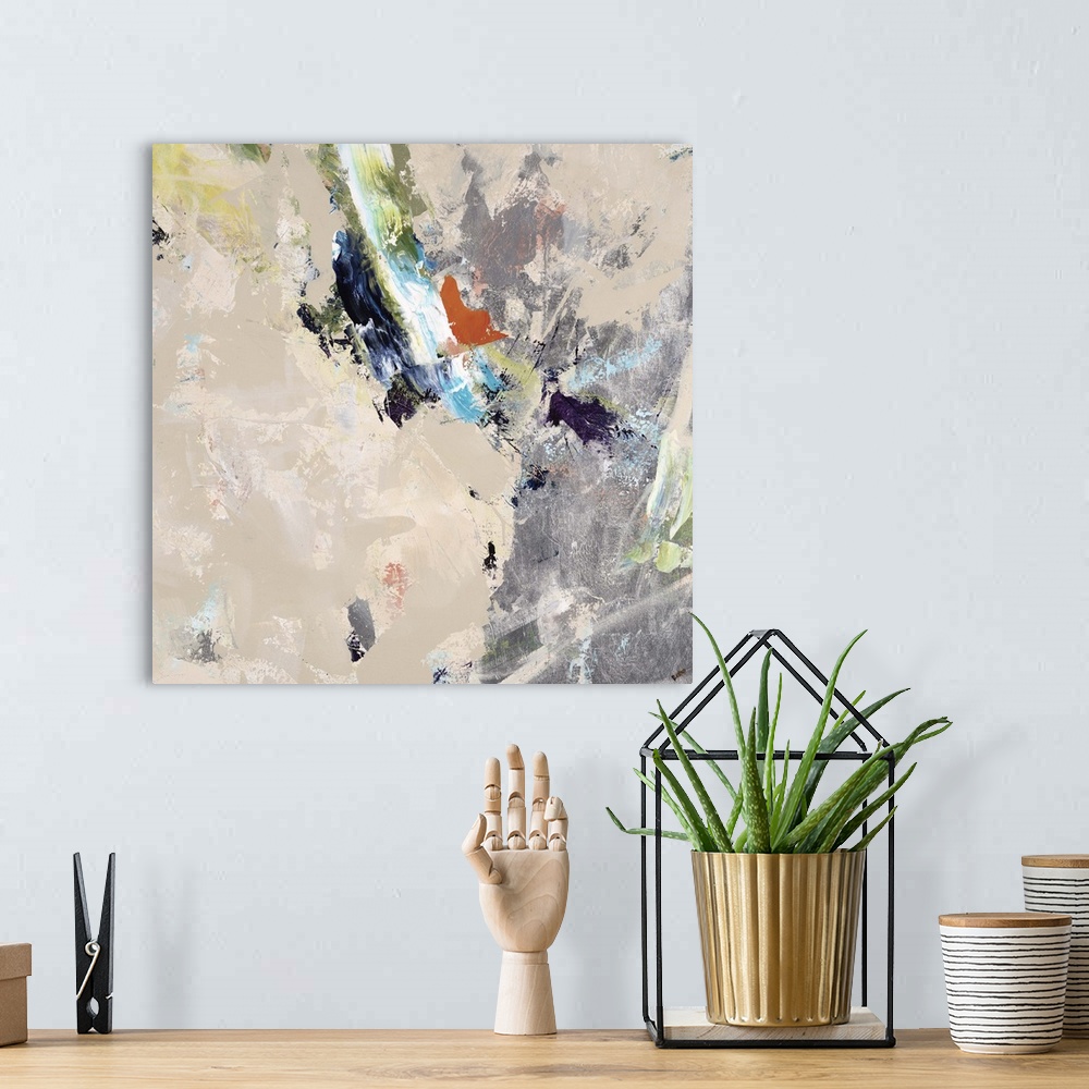 A bohemian room featuring Abstract painting of a large silver object surrounded my small shapes in various colors, on a lig...