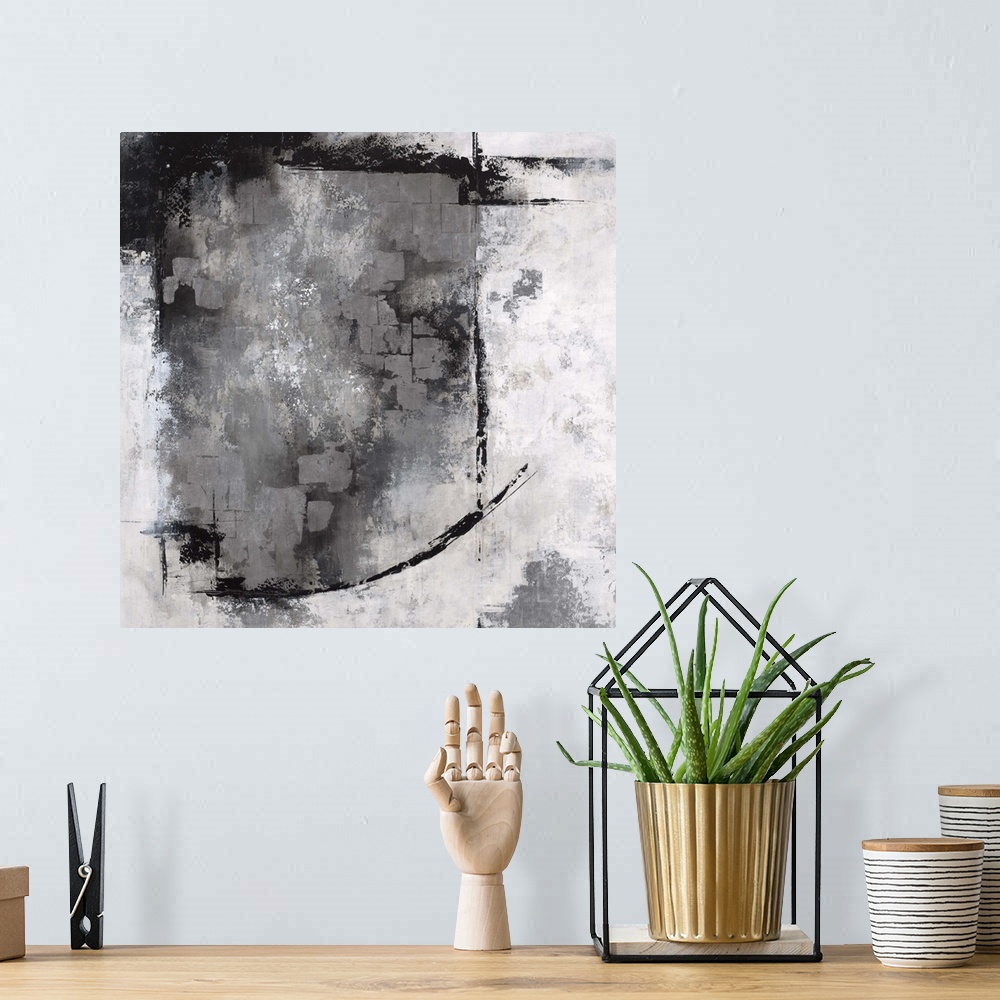 A bohemian room featuring Abstract contemporary artwork in grey, black, and white, with a heavy textured effect.