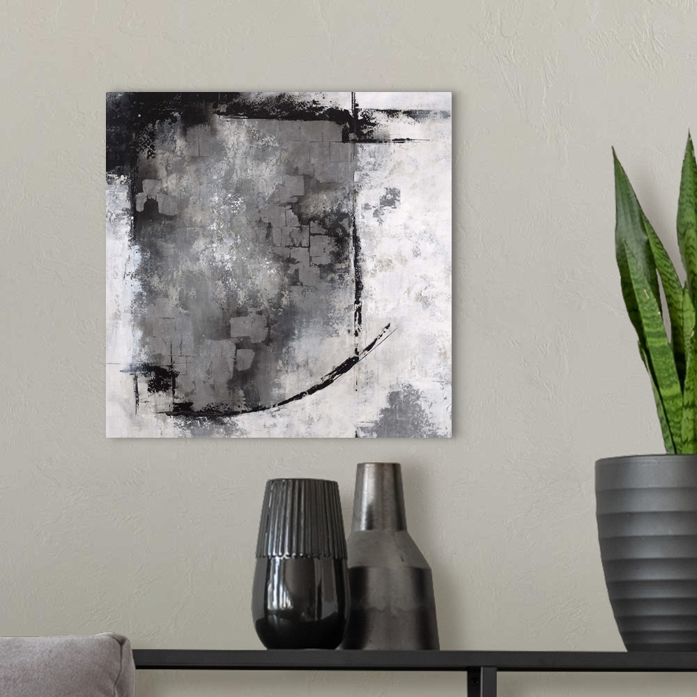 A modern room featuring Abstract contemporary artwork in grey, black, and white, with a heavy textured effect.