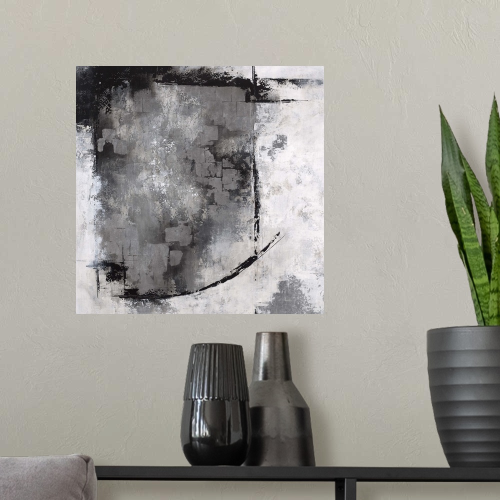 A modern room featuring Abstract contemporary artwork in grey, black, and white, with a heavy textured effect.
