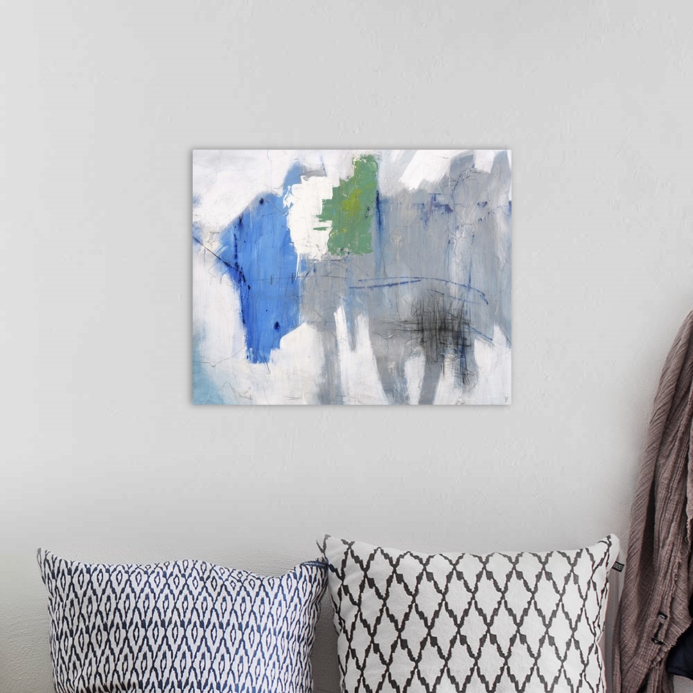A bohemian room featuring Contemporary abstract painting of a gray toned background with pops of blue and green.