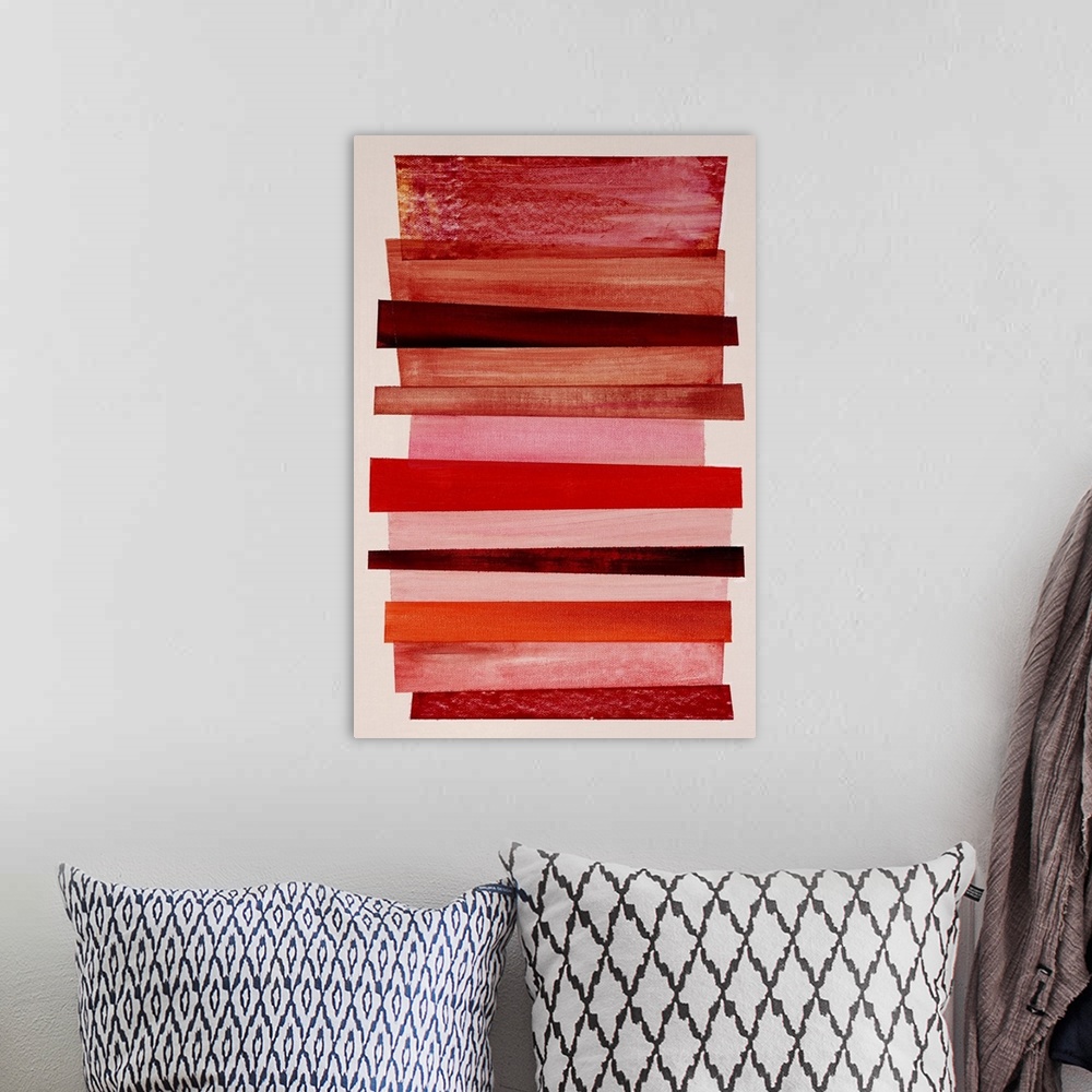 A bohemian room featuring Geometric abstract painting that has an off-white background and a mixture of red and pink differ...