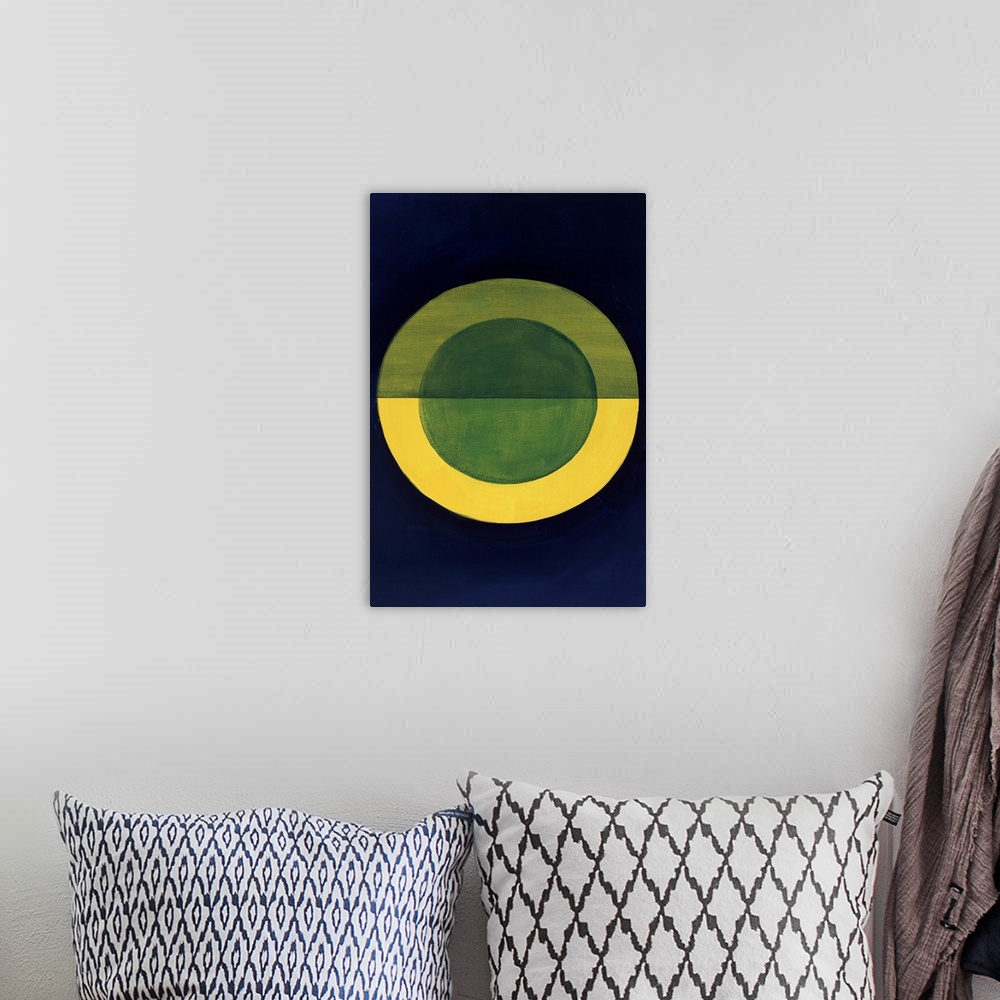A bohemian room featuring Geometric abstract painting with a dark blue background and a gold circle in the center with a bl...