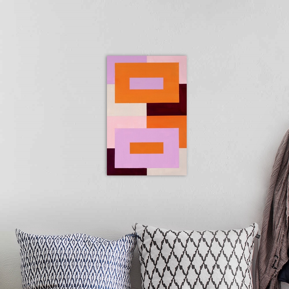A bohemian room featuring Geometric abstract painting that has a background made out of colorful squares and two large rect...